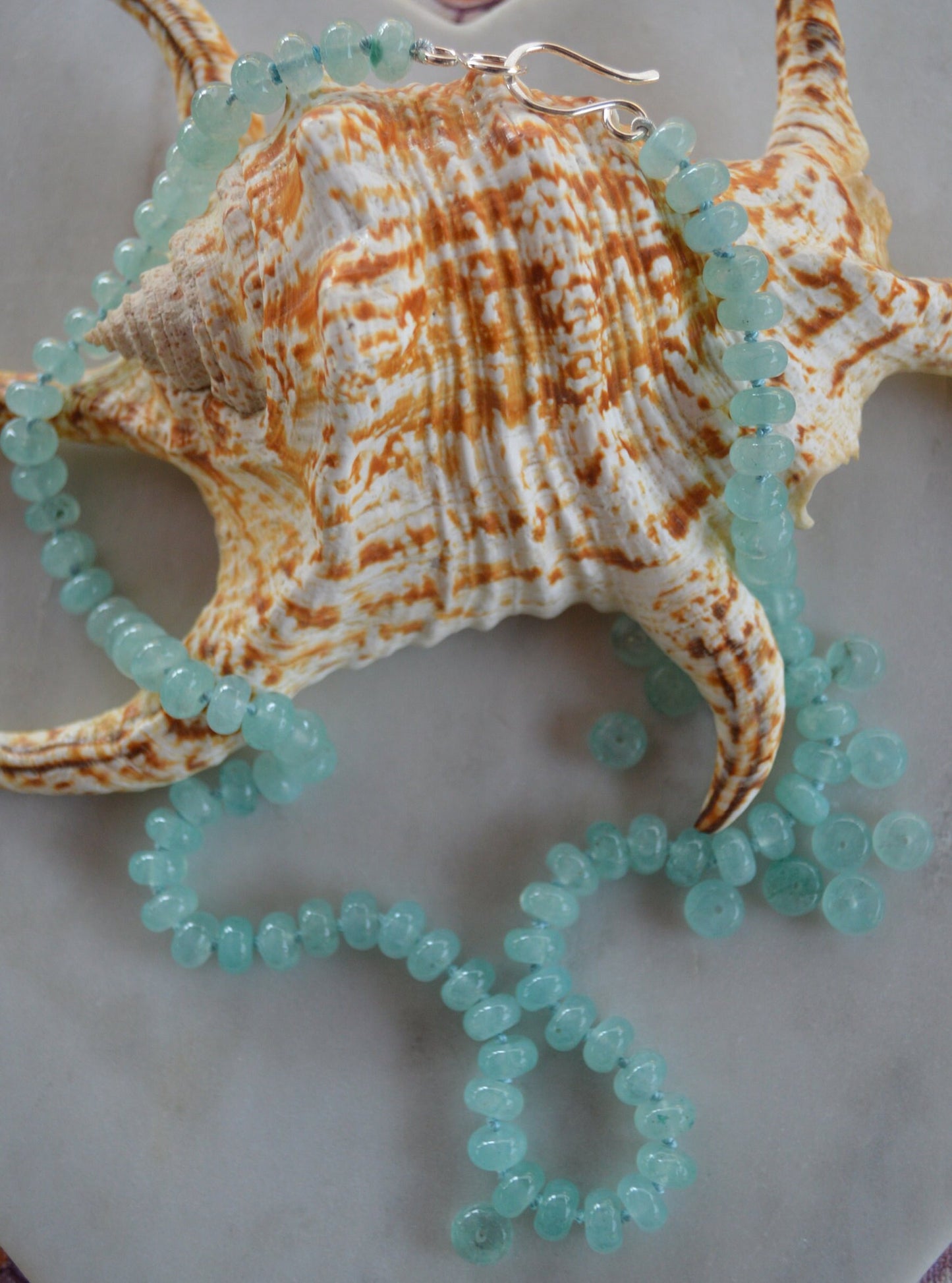 Aqua Blue Chalcedony Smooth Rondelle Natural AAA Gemstones Hand knotted on Turquoise Silk. Sterling Silver Hook and Eye Clasp. 20"