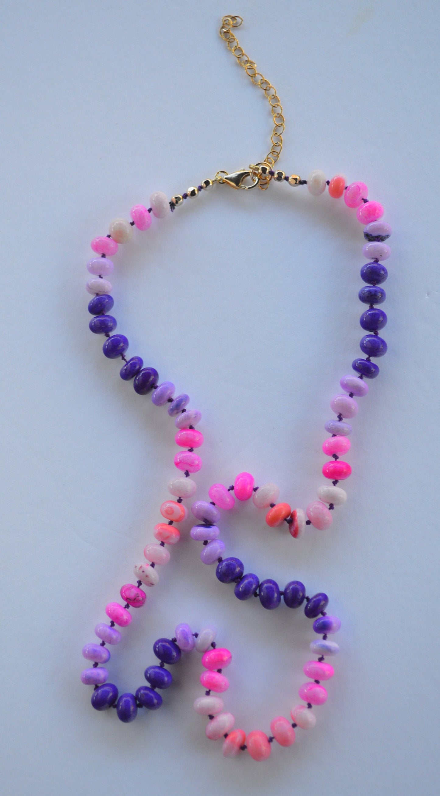22" Pink and Purple Smooth Rondelle Opal Rondelle Beads Hand Knotted on Dark Amethyst Silk. Comes with 3" Gold Filled Extender Chain