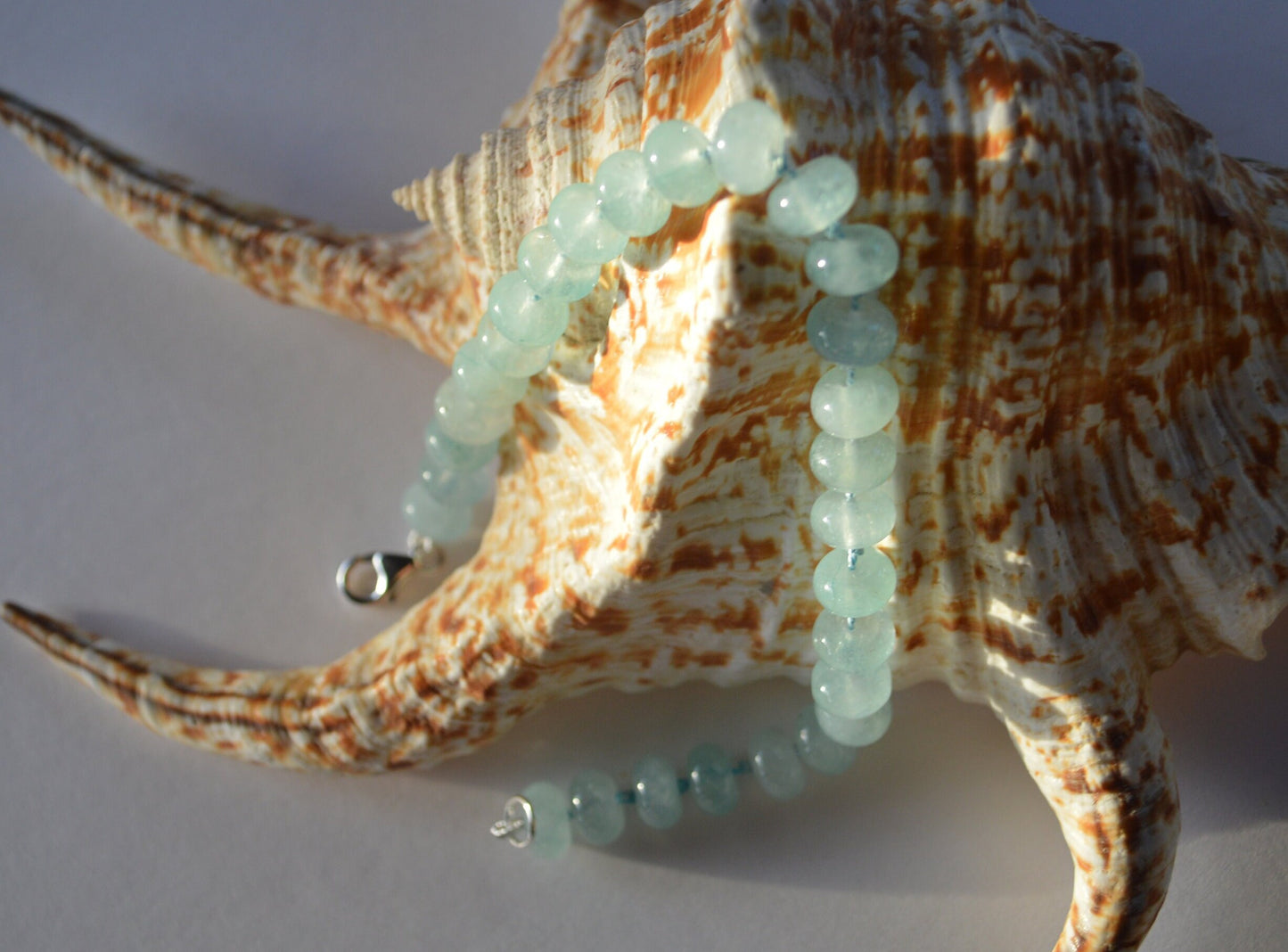 Natural Aqua Blue Chalcedony Bracelet Hand Knotted on Turquoise Silk. Sterling Lobster Clasp. 7 1/2" --8" Length. 8mm Beads