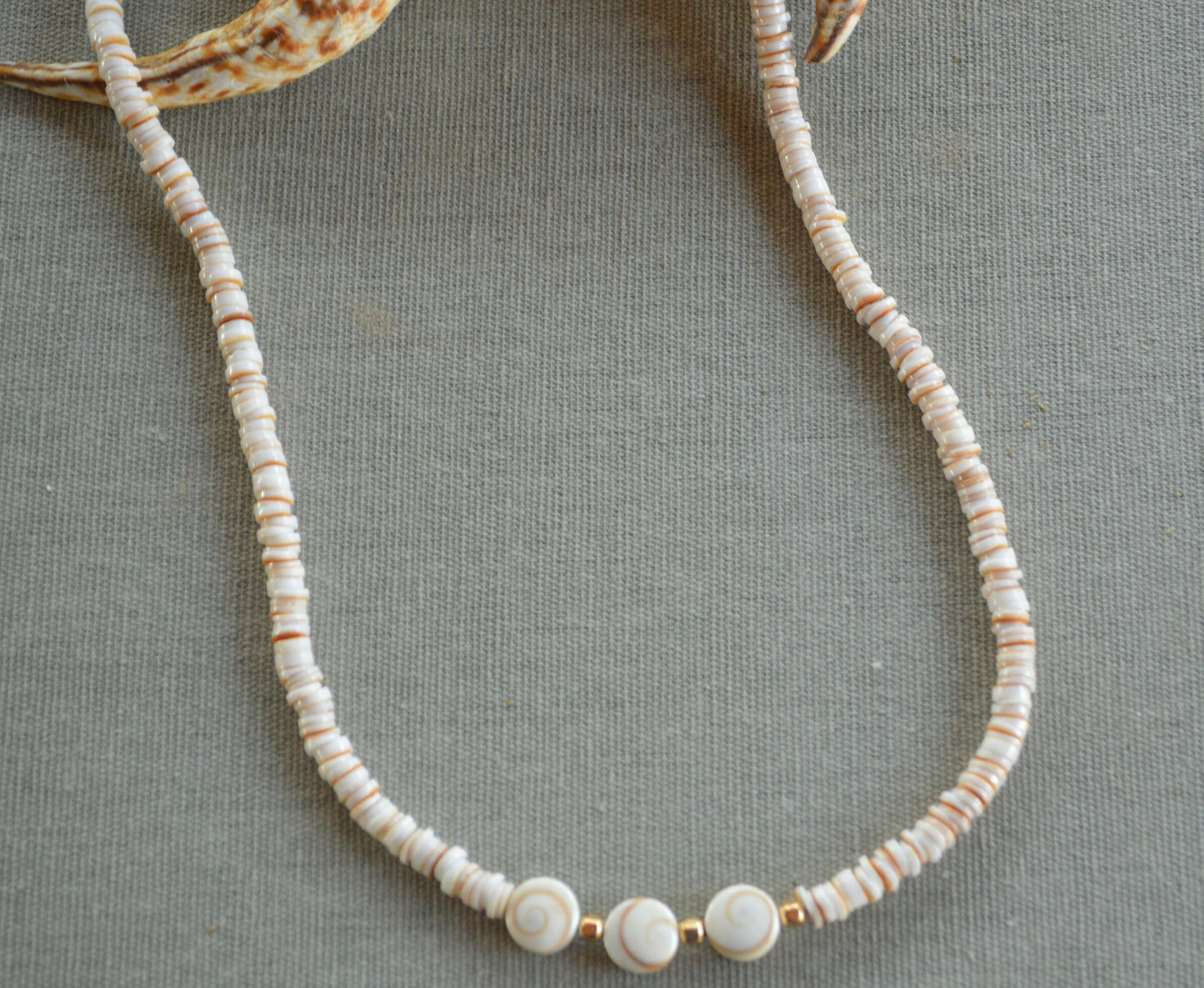 Beachy and Pretty! Conus Heishi Shell Necklace with 3 Shiva Eye Shells.  18K Gold Filled Lobster Clasp and Beads.