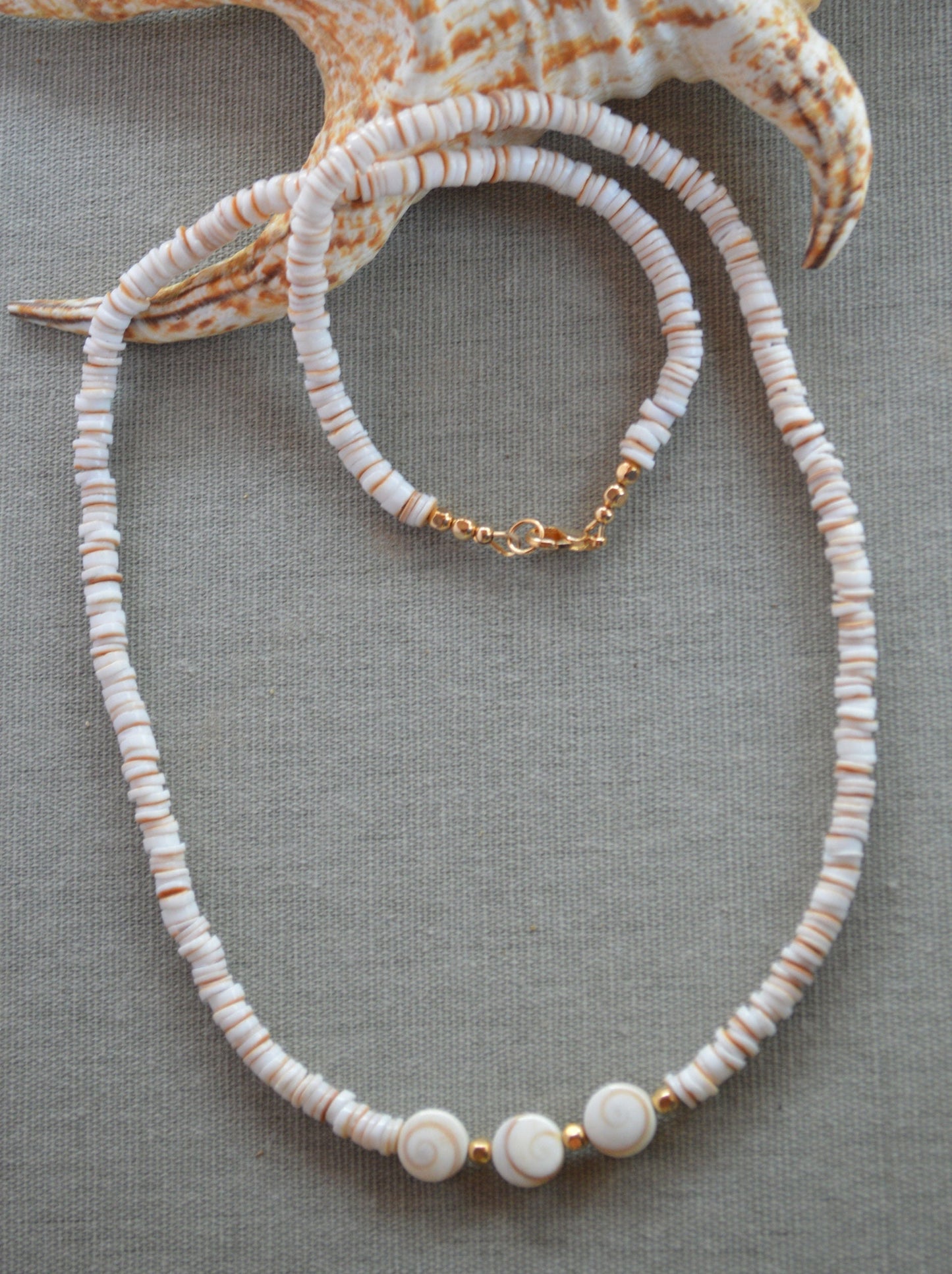 Beachy and Pretty! Conus Heishi Shell Necklace with 3 Shiva Eye Shells.  18K Gold Filled Lobster Clasp and Beads.