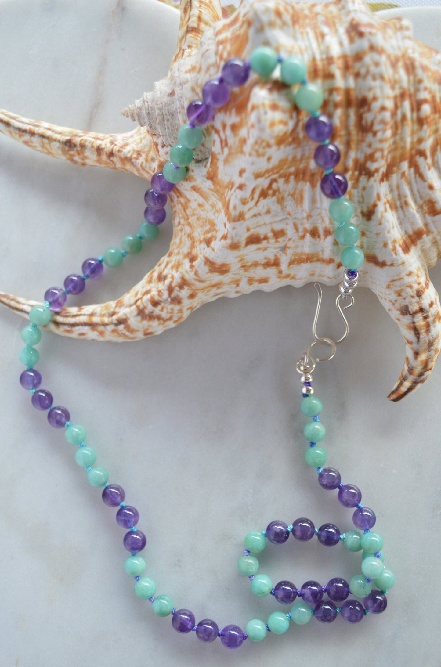 Hand Knotted Natural Amazonite and Amethyst Beads on Teal and Turquoise Silk Thread.  Hand Forged Sterling Hook and Eye Clasp and Beads. 21"