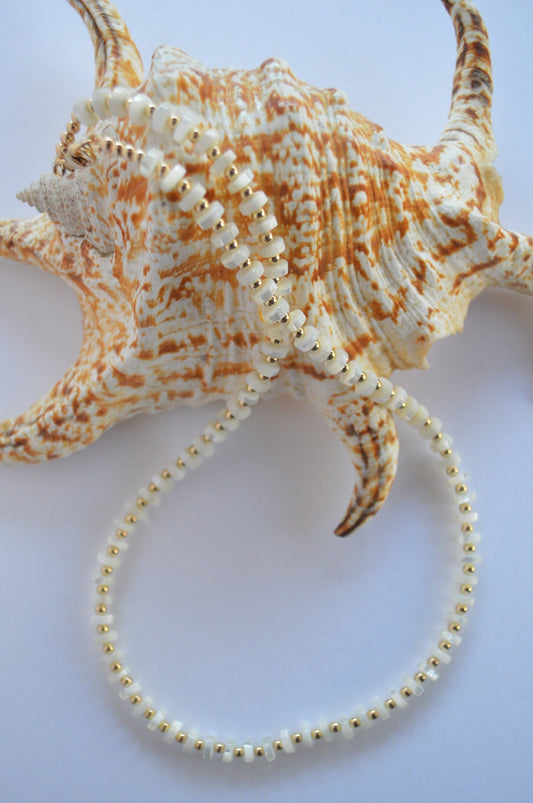 Luminous and Iridescent Mother of Pearl Heishi Necklace with 18K Gold Filled Beads and Lobster Clasp.  18", 6mm Round Shells