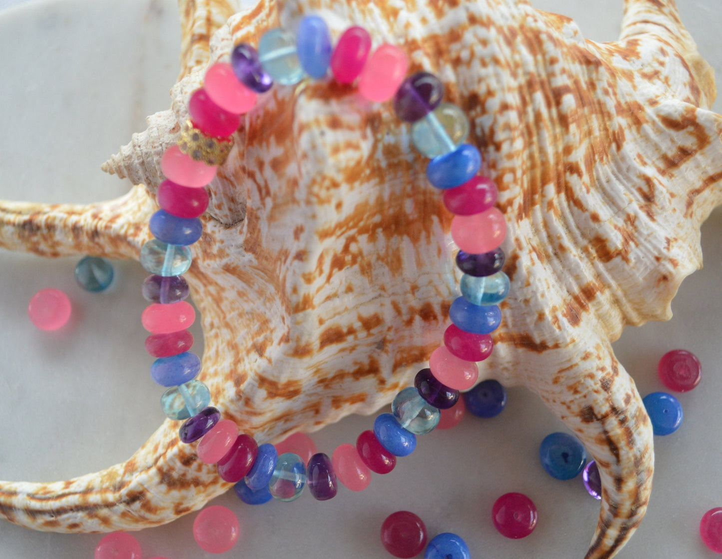 Stunning Multi Gemstone Bracelet With CZ 22K Pave Bead. One Size Fits All. Amethyst, Blue Topaz, Pink and Blue Opals. Can Be Made Any Size