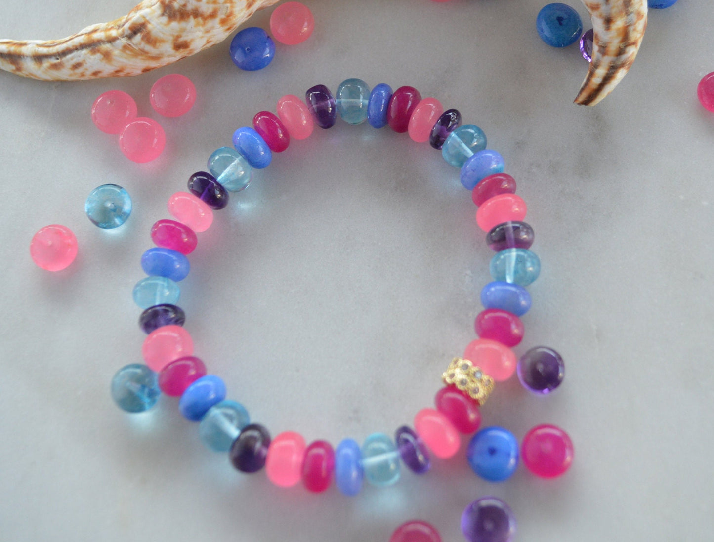 Stunning Multi Gemstone Bracelet With CZ 22K Pave Bead. One Size Fits All. Amethyst, Blue Topaz, Pink and Blue Opals. Can Be Made Any Size