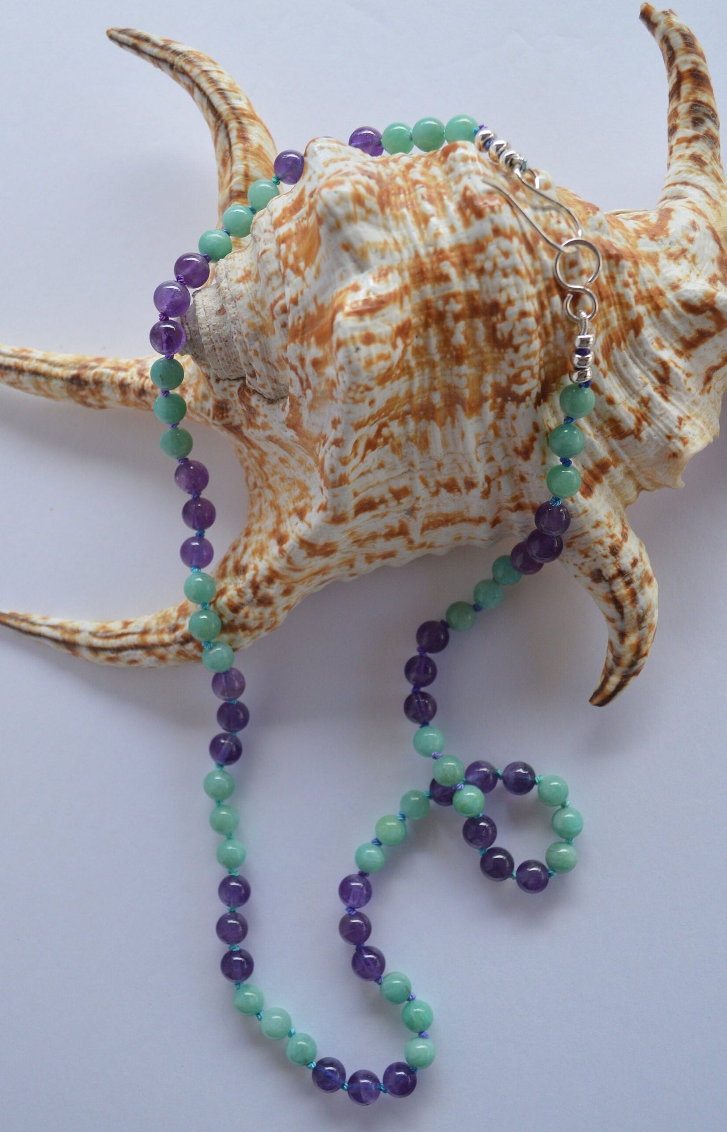 Hand Knotted Natural Amazonite and Amethyst Beads on Teal and Turquoise Silk Thread.  Hand Forged Sterling Hook and Eye Clasp and Beads. 21"