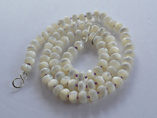 22" Iridescent Mother of Pearl Rondelle Beads Hand Knotted on Dark Purple Silk. Hand Forged Sterling Silver Hook and Eye Clasp