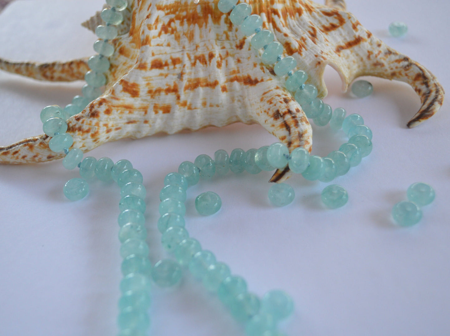 Aqua Blue Chalcedony Smooth Rondelle Natural AAA Gemstones Hand knotted on Turquoise Silk. Sterling Silver Hook and Eye Clasp. 20"