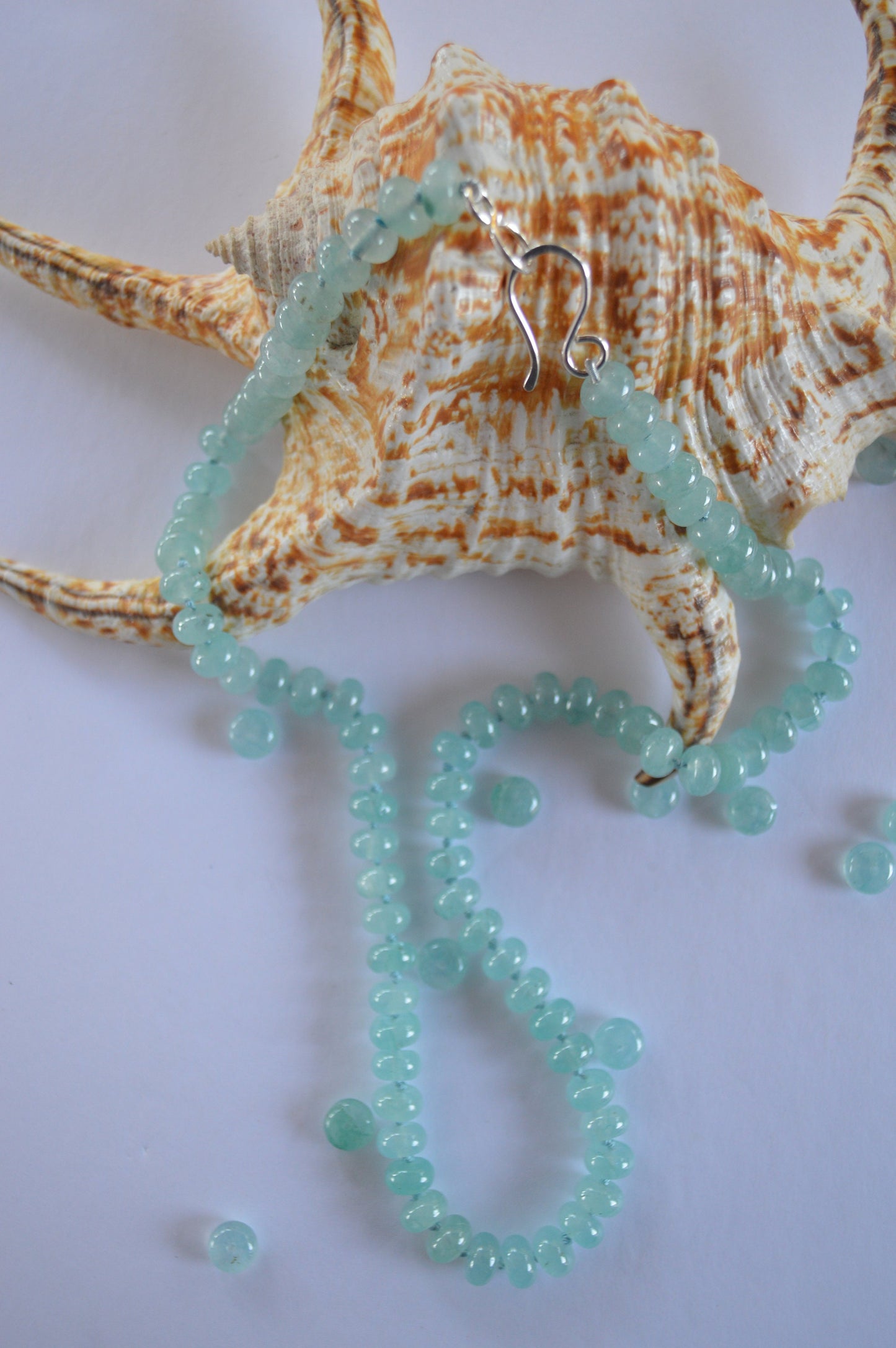 Aqua Blue Chalcedony Smooth Rondelle Natural AAA Gemstones Hand knotted on Turquoise Silk. Sterling Silver Hook and Eye Clasp. 20"