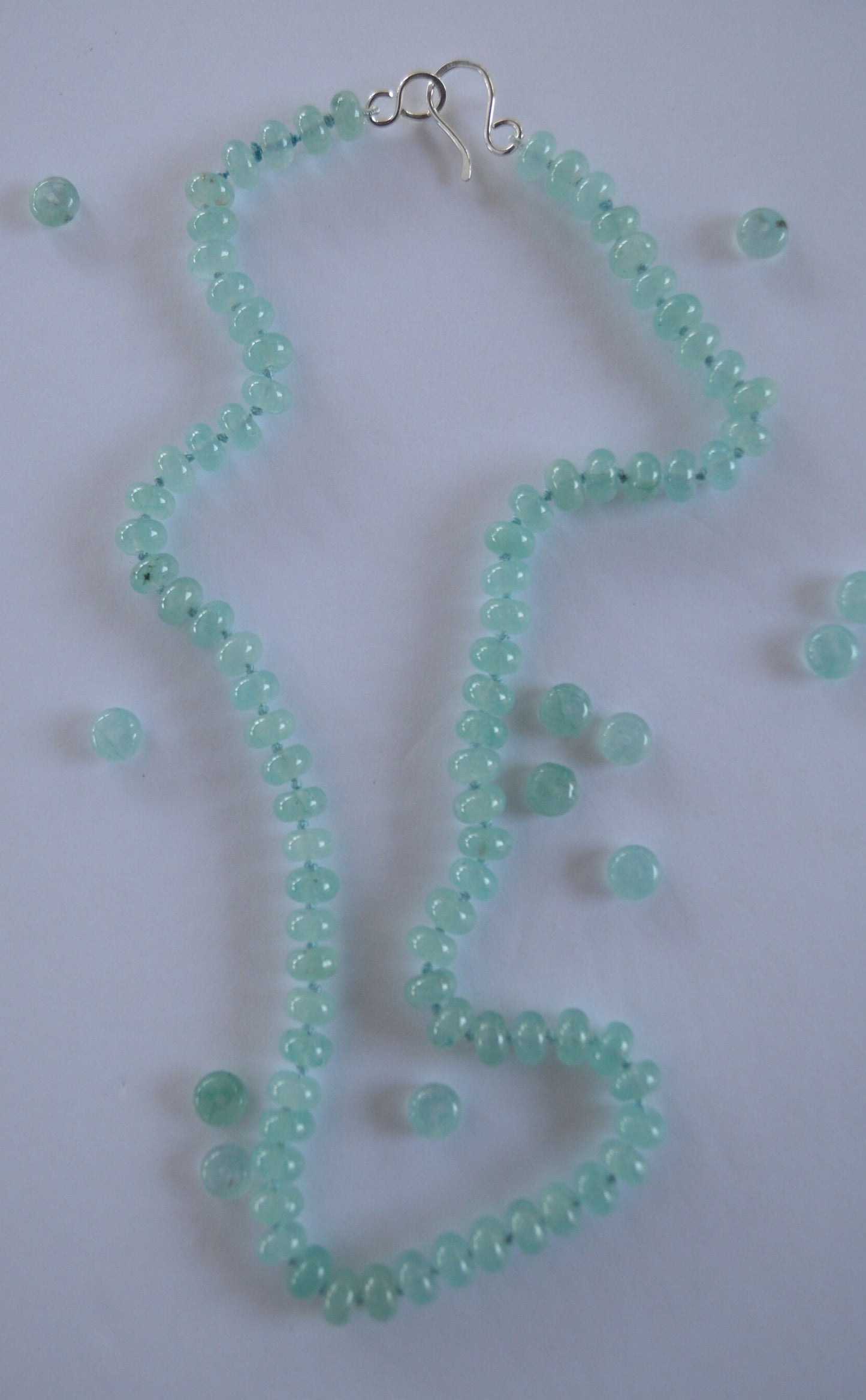 Aqua Blue Chalcedony Smooth Rondelle Natural AAA Gemstones Hand knotted on Turquoise Silk. Sterling Silver Hook and Eye Clasp. 20"