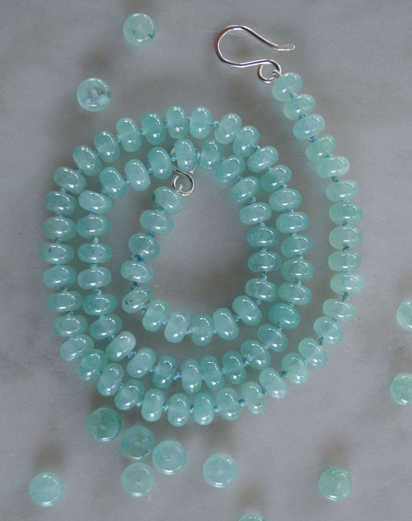 Aqua Blue Chalcedony Smooth Rondelle Natural AAA Gemstones Hand knotted on Turquoise Silk. Sterling Silver Hook and Eye Clasp. 20"