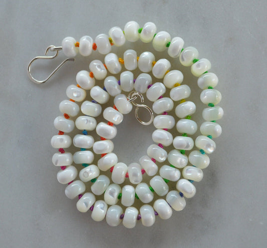 Iridescent AAA Natural White Mother of Pearl 8mm Rondelle Beaded Necklace Hand Knotted on Multi Colored Silk Thread. Sterling Hook and Eye.