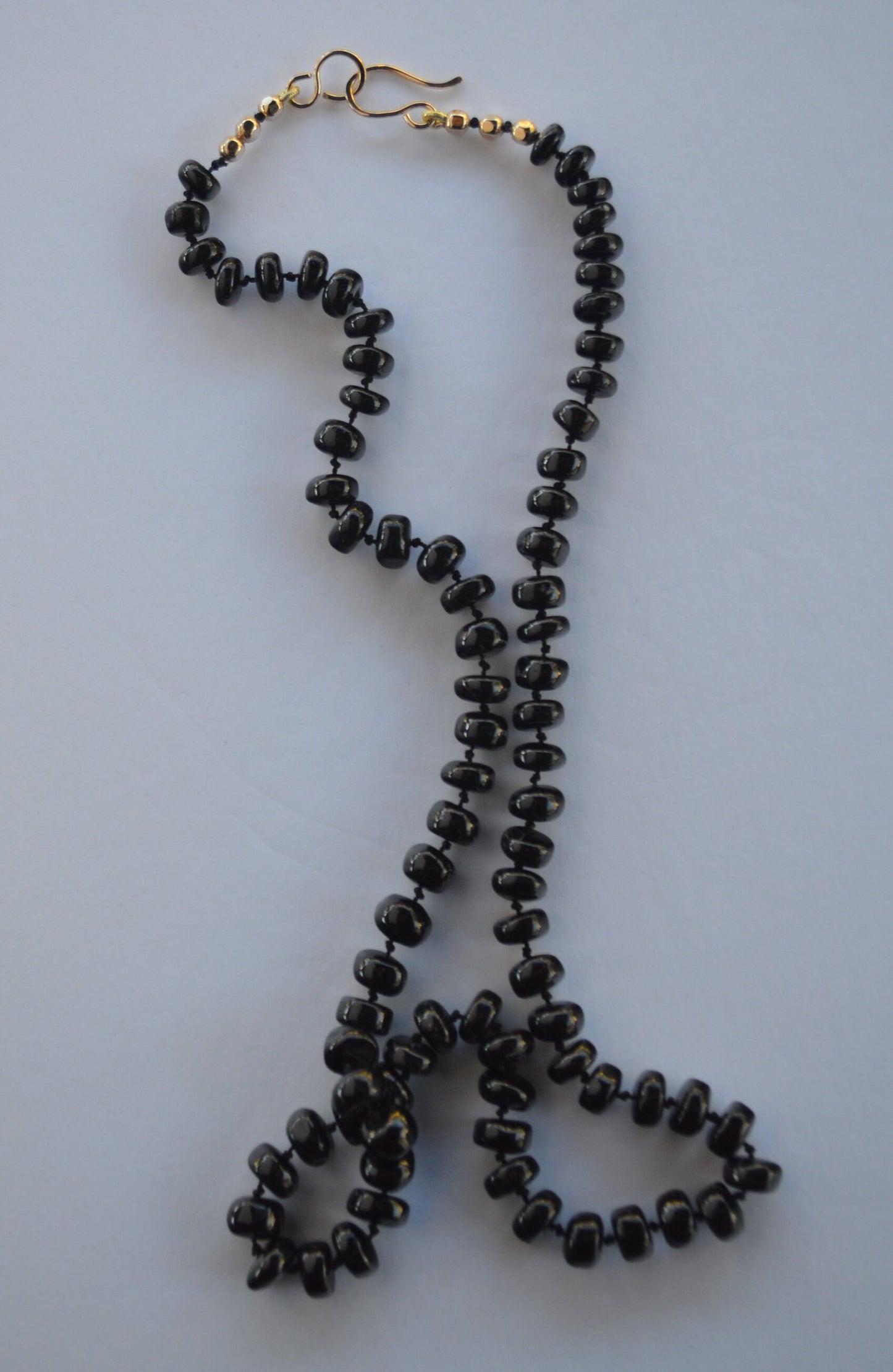 Black Spinel 8mm Smooth Rondelle Necklace Hand Knotted on Black Silk. 18k Gold Filled Hook and Eye Clasp and Beads.  Valentine's Day Sale