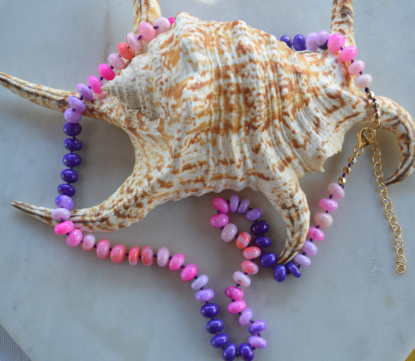 22" Pink and Purple Smooth Rondelle Opal Rondelle Beads Hand Knotted on Dark Amethyst Silk.  Comes with 3" Gold Filled Extender Chain