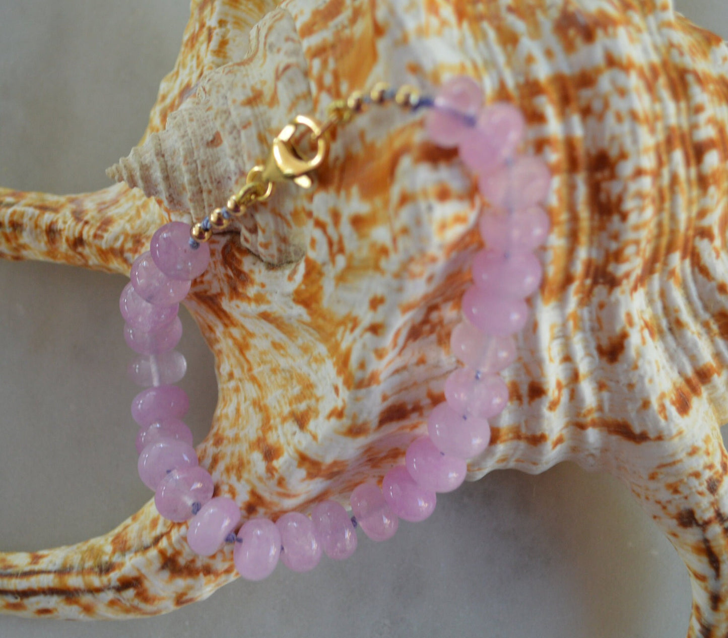 Lavender Quartz Rondelle Bracelet Hand Knotted on Lavender Silk.  7- 3/4". Gold Filled Lobster Claw Clasp and Faceted Beads