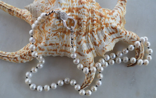 20"  Freshwater Pearl Necklace Hand Knotted on Black Silk. Shiny CZ Lobster Claw Clasp That Can Be Worn in the Front or Back. 7-8 mm Pearls