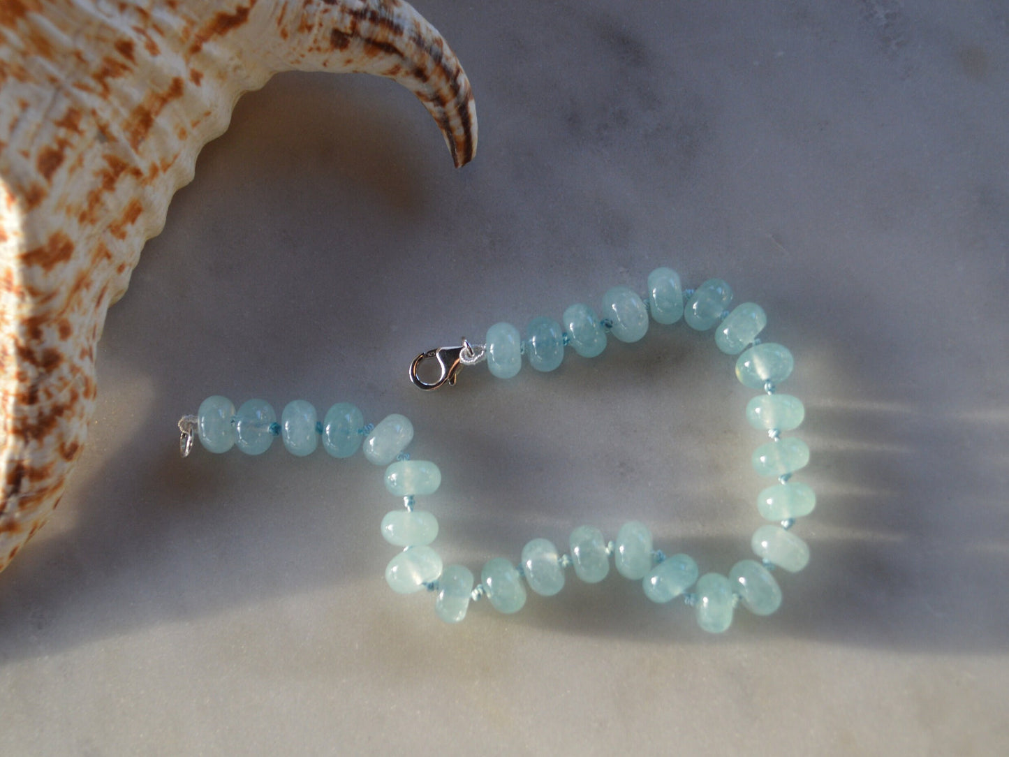 Natural Aqua Blue Chalcedony Bracelet Hand Knotted on Turquoise Silk. Sterling Lobster Clasp. 7 1/2" --8" Length. 8mm Beads