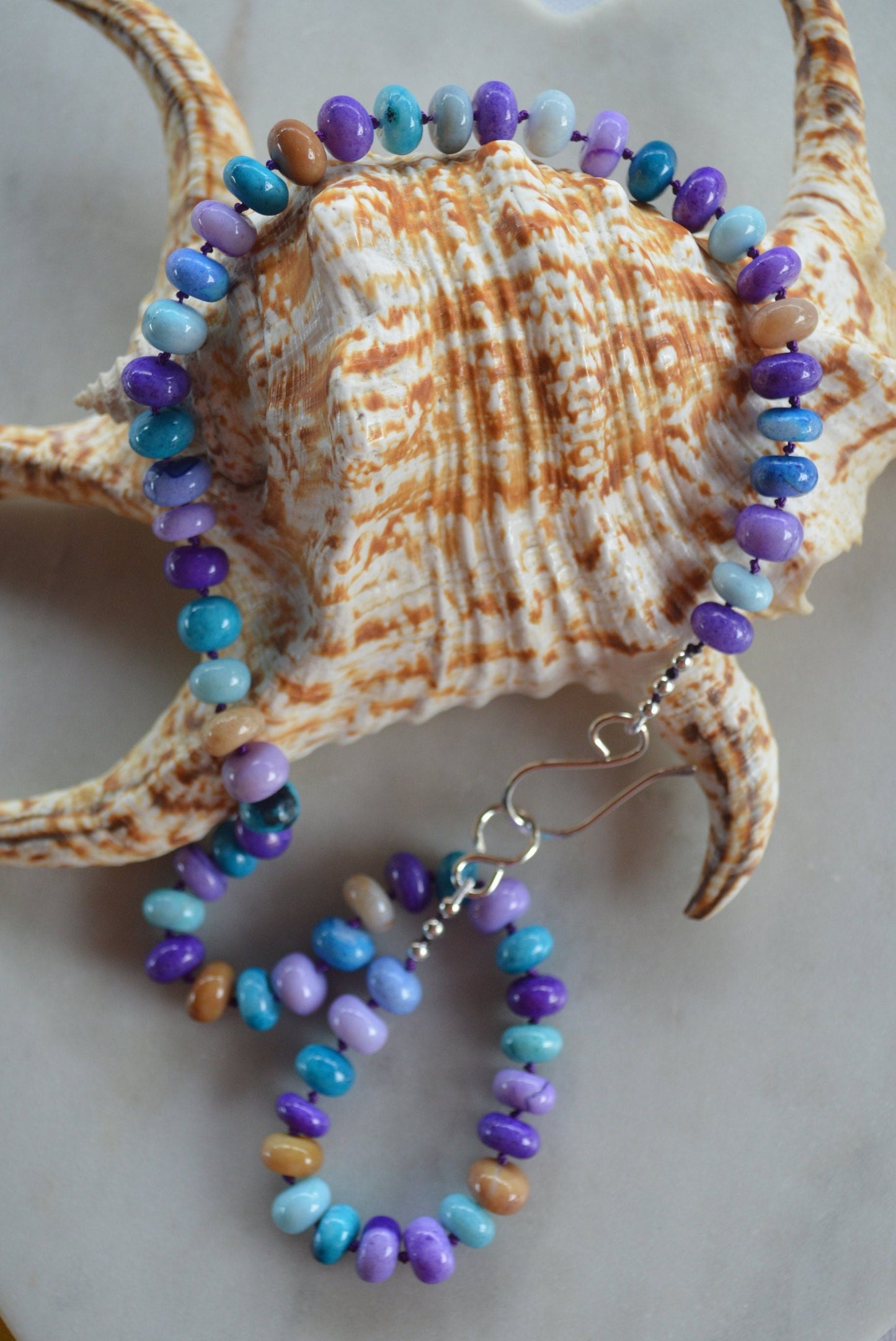 Purple, Lilac, Blue and Mocha Smooth Opal 19" Necklace Hand Knotted on Purple Silk.  Sterling Silver Hand Forged Hook and Eye Clasp.