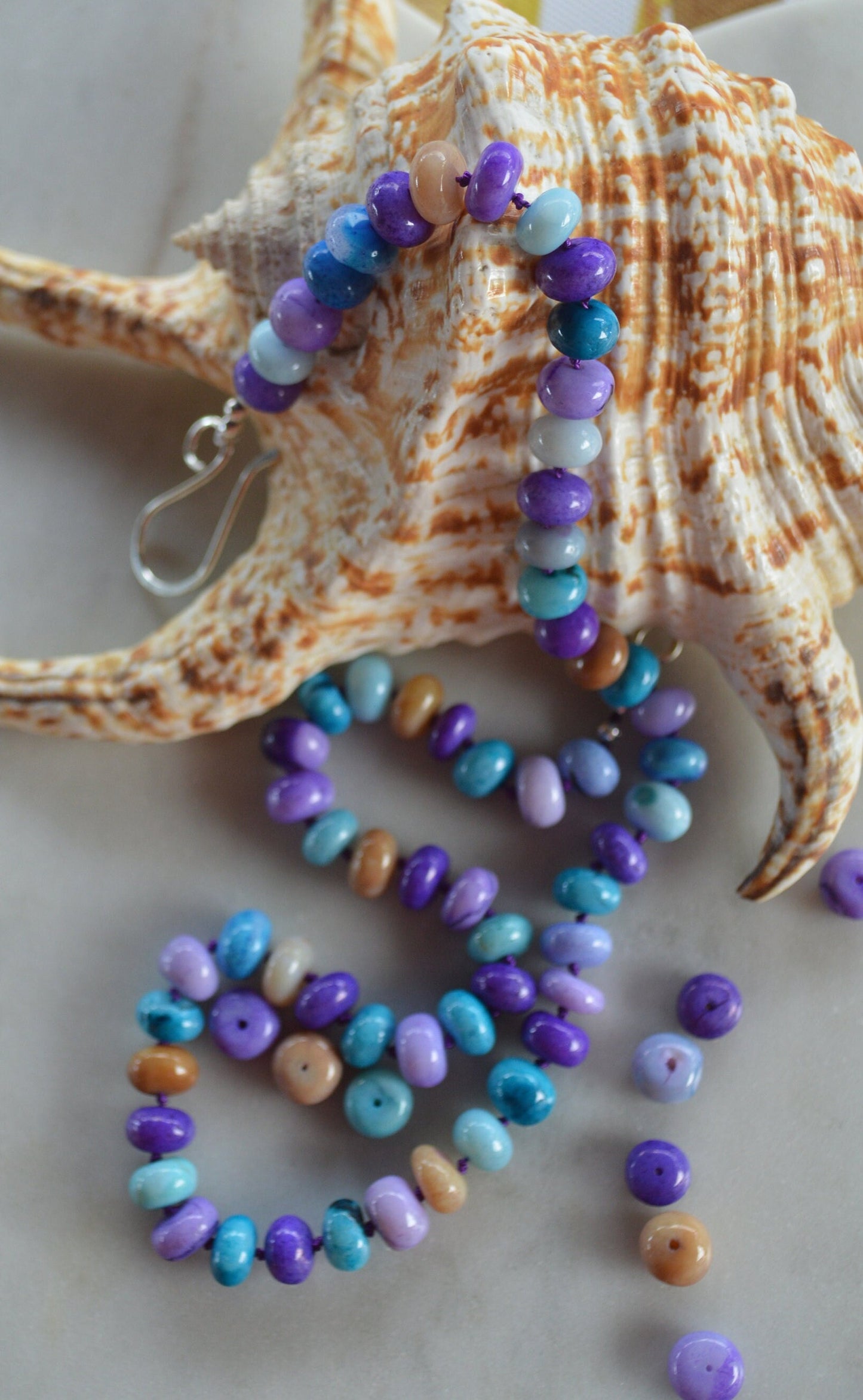 Purple, Lilac, Blue and Mocha Smooth Opal 19" Necklace Hand Knotted on Purple Silk.  Sterling Silver Hand Forged Hook and Eye Clasp.