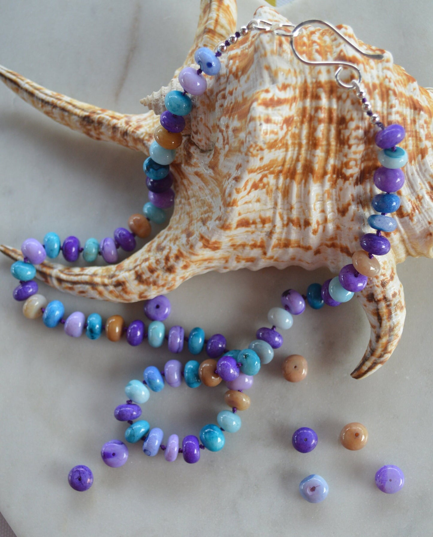 Purple, Lilac, Blue and Mocha Smooth Opal 19" Necklace Hand Knotted on Purple Silk.  Sterling Silver Hand Forged Hook and Eye Clasp.