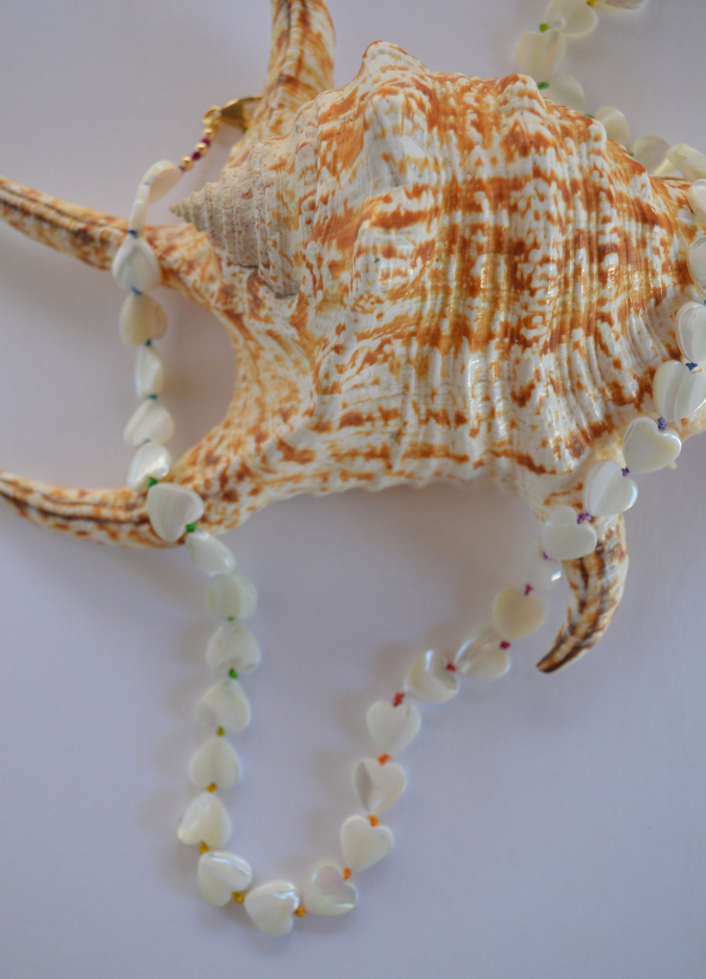Shimmery and Iridescent Necklace.  Mother of Pearl Heart Beads Knotted on Multicolored Silk.  GF Italian Lobster Claw and Beads. 19"