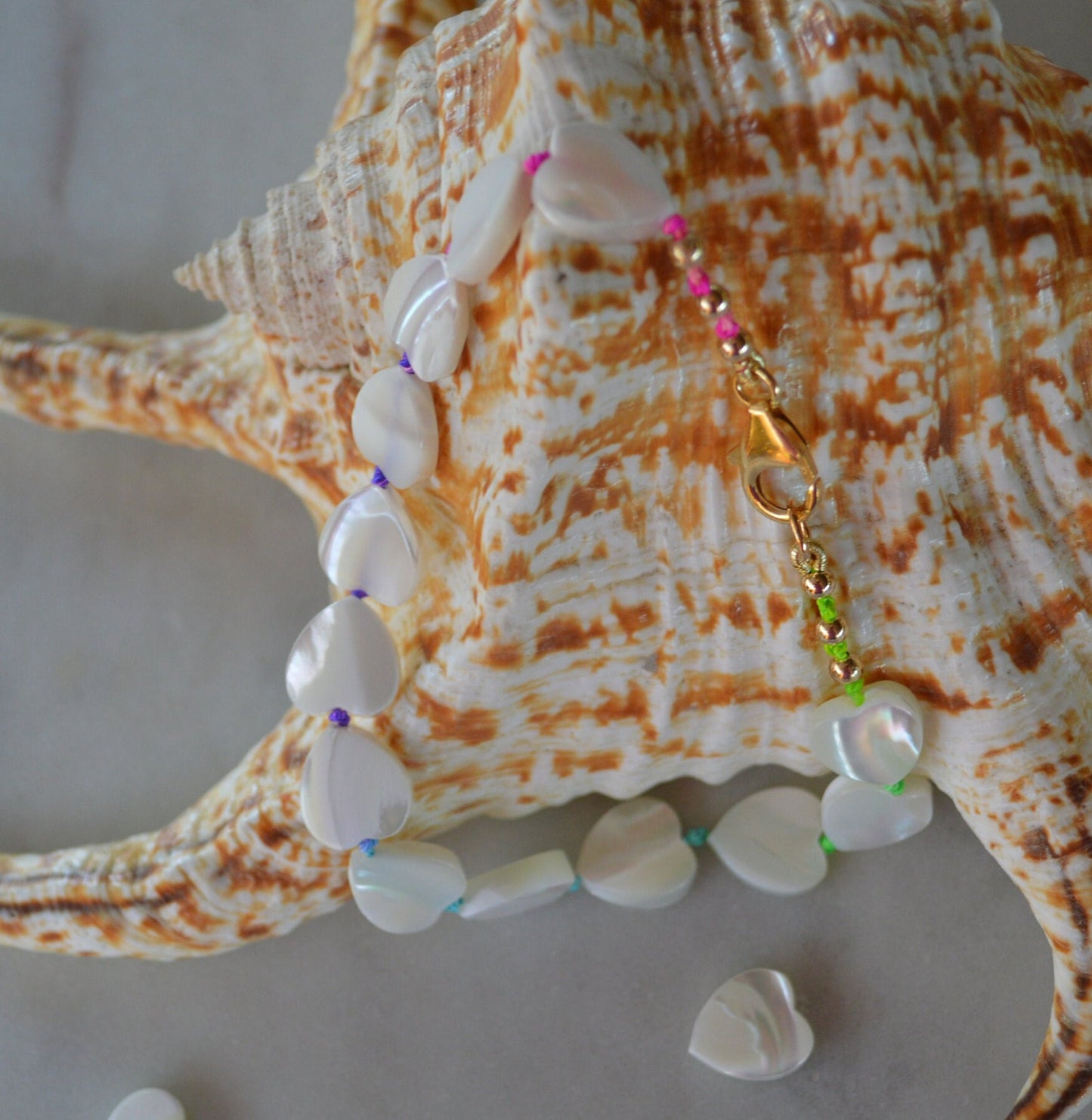 Beautiful Mother of Pearl Heart Bead Bracelet Hand Knotted on Multicolored Silk Thread.  Gold Filled Lobster Claw and Beads. 8 or 10 mm.
