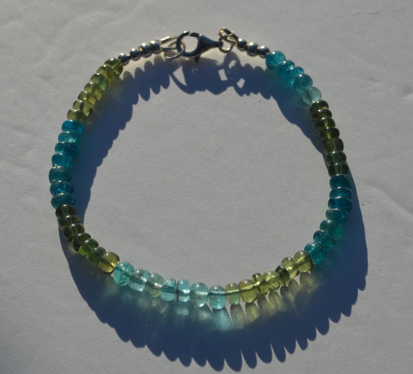 Beautiful High Grade Blue and Green Apatite Gemstone Bracelet, Sterling Silver Lobster Clasp and Beads.  Gemstones are Smooth Rondelles.