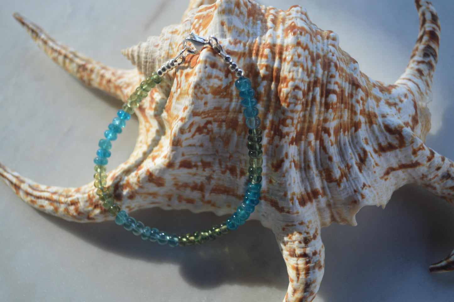 Beautiful High Grade Blue and Green Apatite Gemstone Bracelet, Sterling Silver Lobster Clasp and Beads.  Gemstones are Smooth Rondelles.