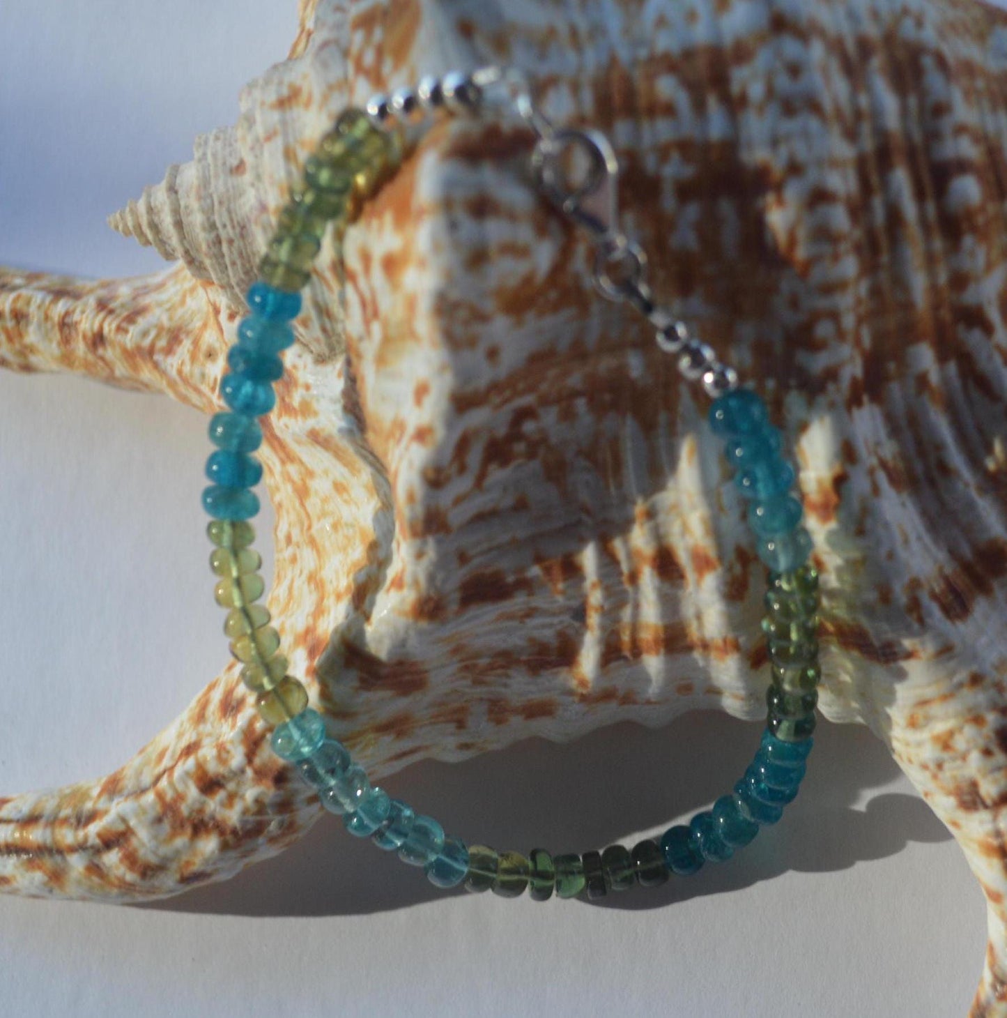 Beautiful High Grade Blue and Green Apatite Gemstone Bracelet, Sterling Silver Lobster Clasp and Beads.  Gemstones are Smooth Rondelles.