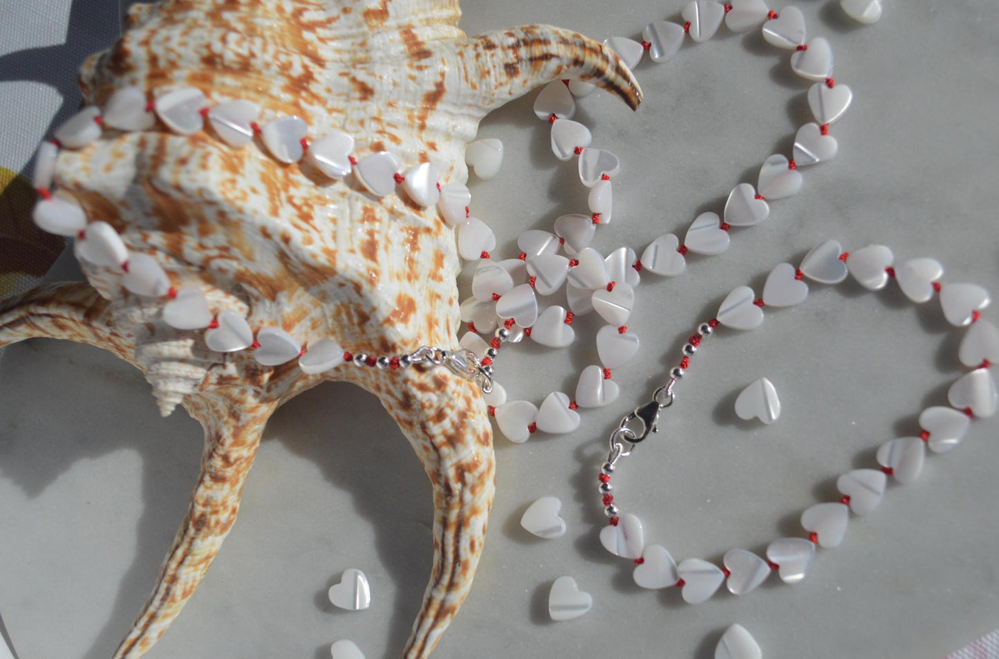 Beautiful 20" Mother of Pearl Hearts Hand Knotted on Red Silk. Sterling Silver Lobster Clasp. A Great Valentine's Day Gift For Her