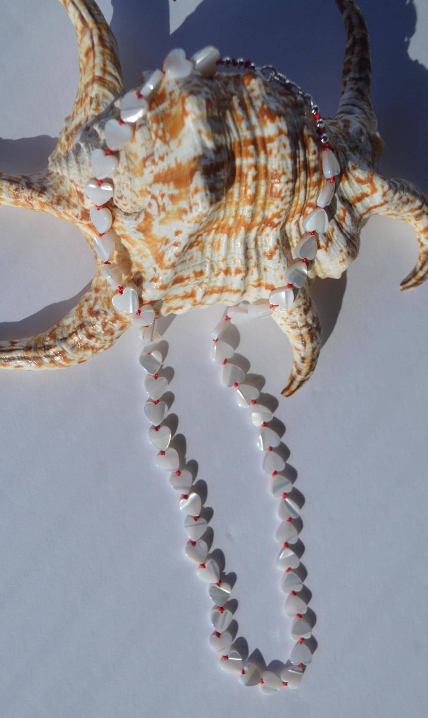 Beautiful 20" Mother of Pearl Hearts Hand Knotted on Red Silk. Sterling Silver Lobster Clasp. A Great Valentine's Day Gift For Her