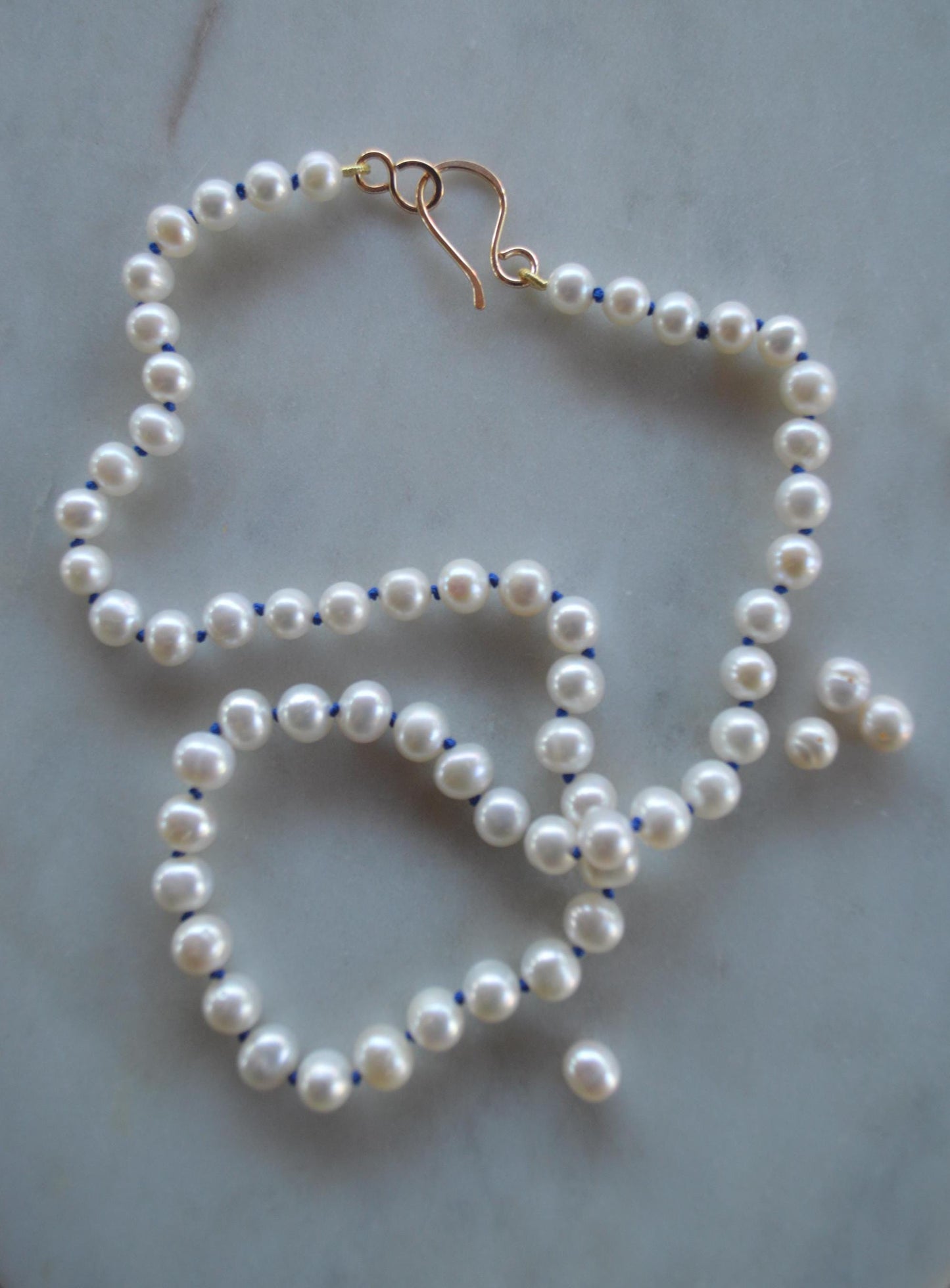 AA Pearls Hand Knotted on Sapphire Blue Silk. 20" With Hand Forged Gold-Filled Hook and Ey Clasp