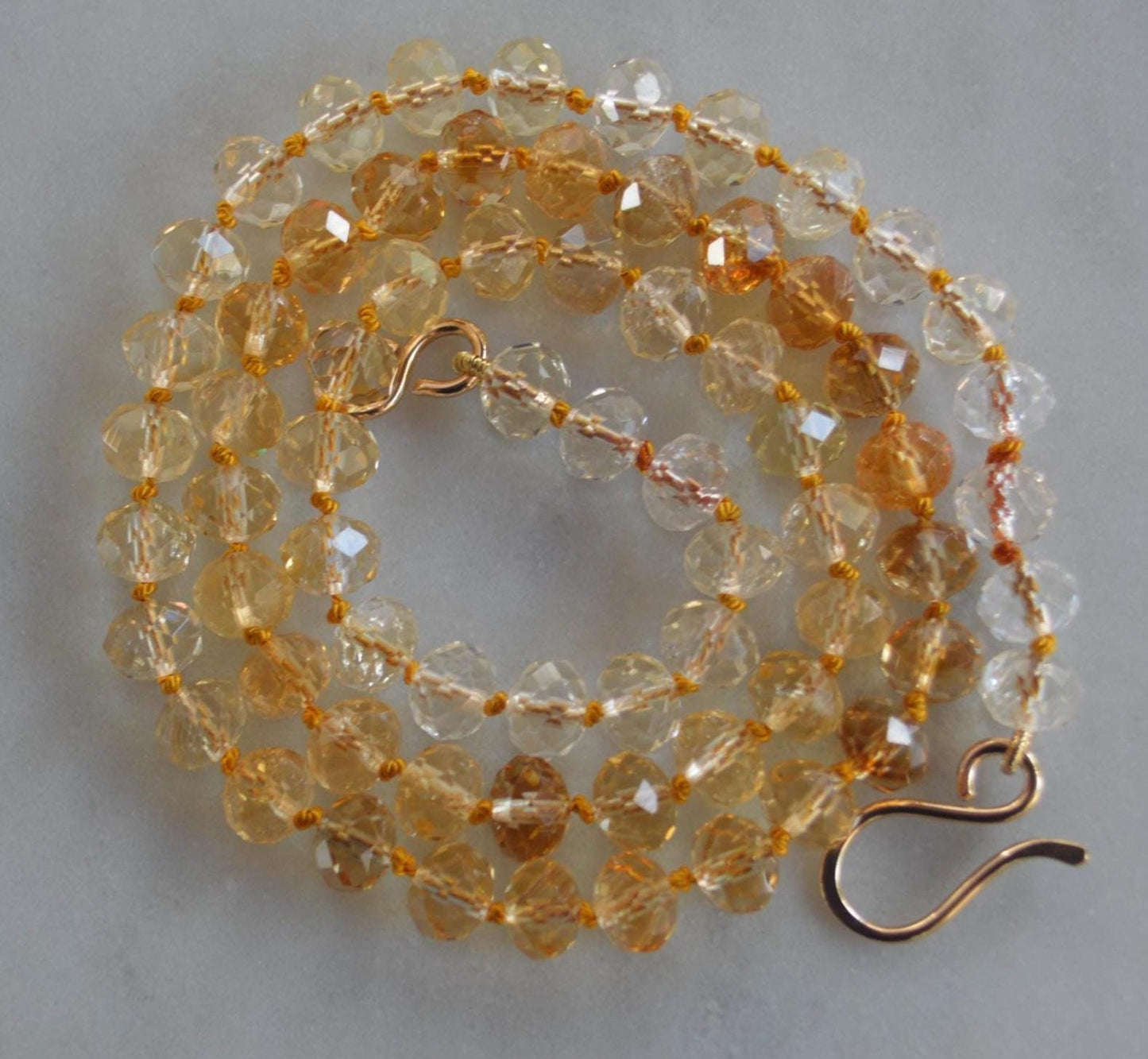 Sparkly High Grade 7mm Faceted Citrine Gemstones Hand Knotted on Gold Silk.  Hand Forged Gold-Filled Hook and Eye Clasp