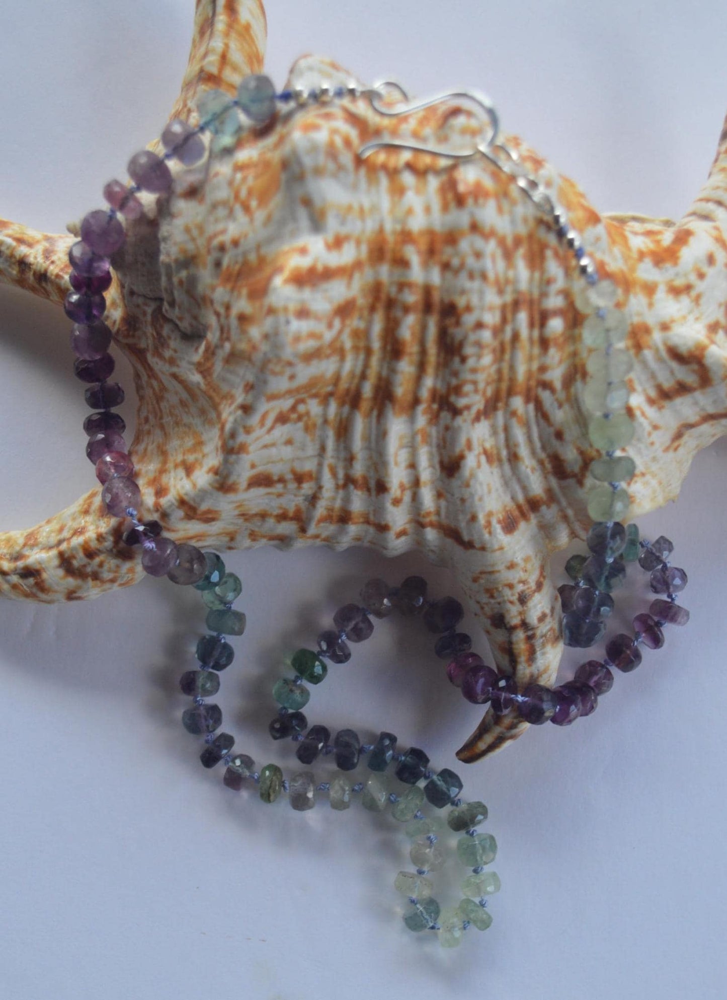 Beautiful 21" Flourite  Faceted Rondelle Necklace Hand Knotted on Lavender Silk. Sterling Silver Hand Forged Hook and Eye Clasp