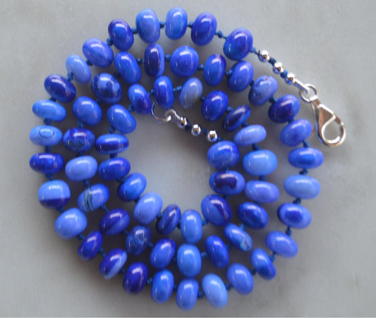 18" Cobalt Blue Smooth Opal Rondelles Hand Knotted on Dark Blue Silk.  This Versatile Piece is Finished with a Sterling Silver Lobster Clasp