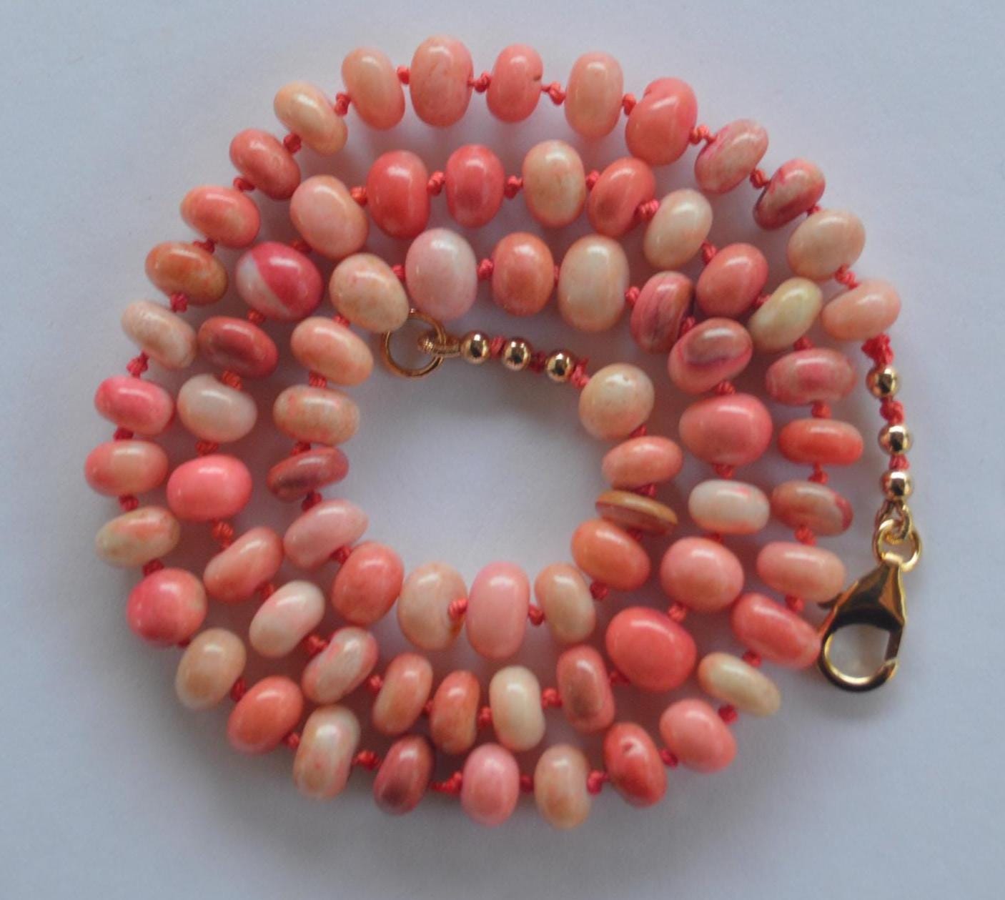 18" Orange and Coral Smooth Rondelle Necklace Hand Knotted on Custom Silk. Gold Filled Lobster Clasp and Beads.