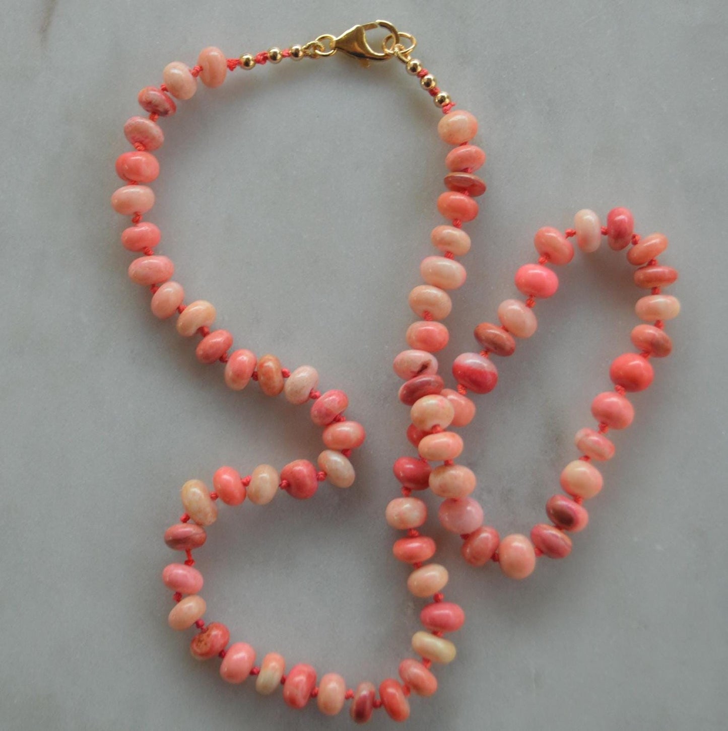18" Orange and Coral Smooth Rondelle Necklace Hand Knotted on Custom Silk. Gold Filled Lobster Clasp and Beads.