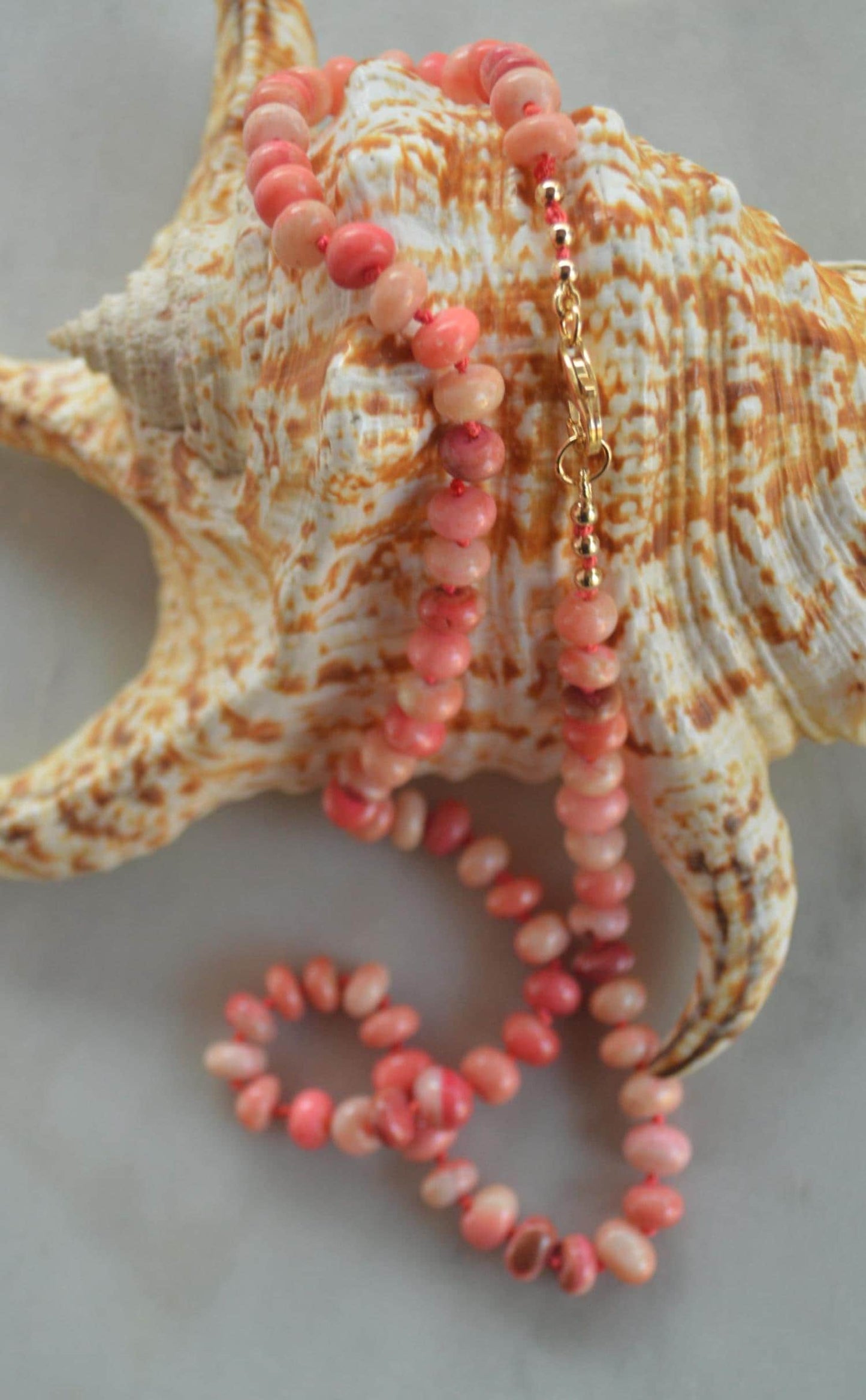 18" Orange and Coral Smooth Rondelle Necklace Hand Knotted on Custom Silk. Gold Filled Lobster Clasp and Beads.
