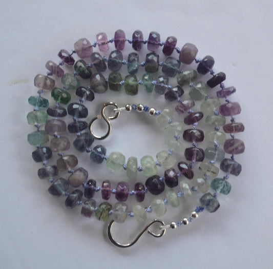Beautiful 21" Flourite  Faceted Rondelle Necklace Hand Knotted on Lavender Silk. Sterling Silver Hand Forged Hook and Eye Clasp