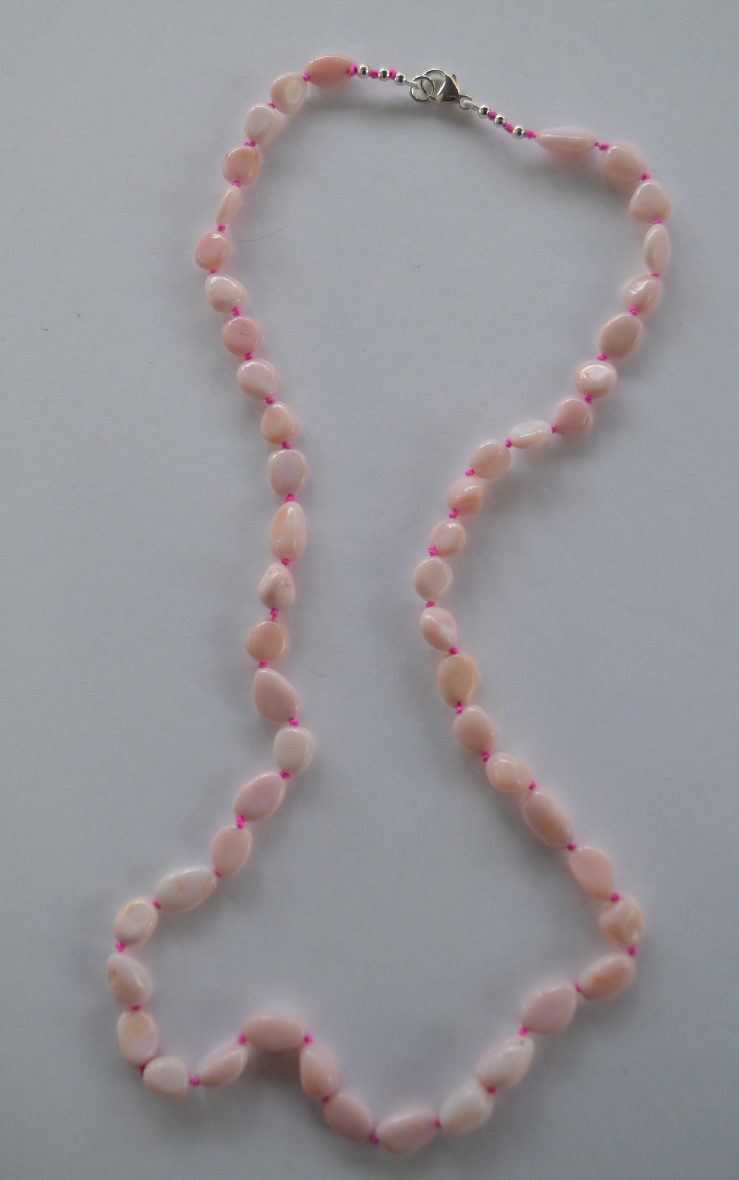 Pink Opal Smooth Nuggets Hand Knotted on Custom Fuchsia Silk and Finished with a Sterling Silver Lobster Clasp