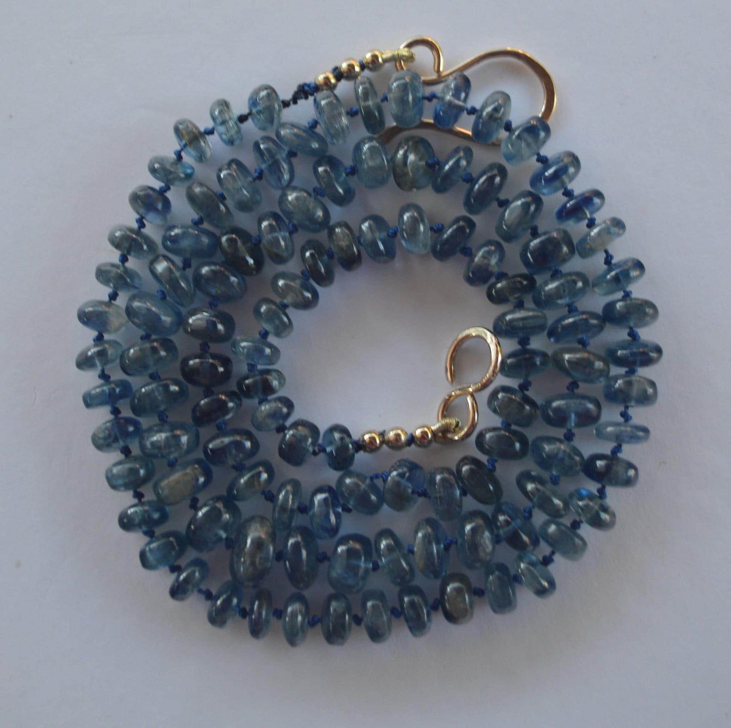 Moss Aquamarine Smooth Rondelle Gemstone Necklace Hand Knotted on Dark Blue Silk.  27.5"