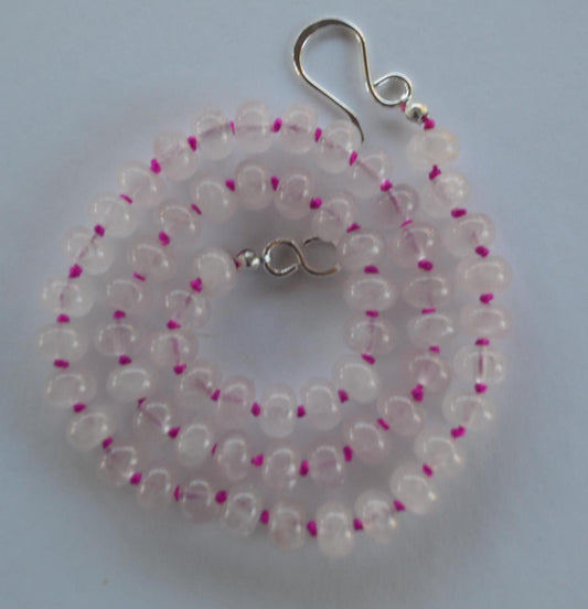 Rose Quartz Smooth Rondelle Gemstones Hand Knotted on Hot Pink or Fuchsia Silk.  18" of Quiet Beauty. Sterling Silver Clasp