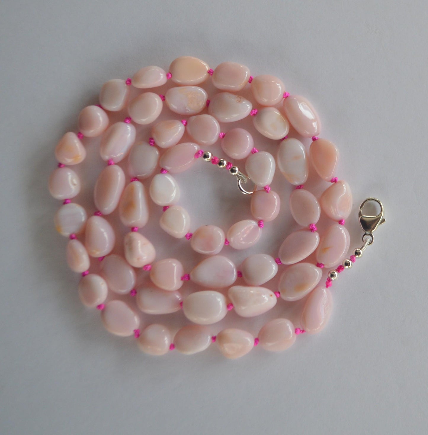 Pink Opal Smooth Nuggets Hand Knotted on Custom Fuchsia Silk and Finished with a Sterling Silver Lobster Clasp
