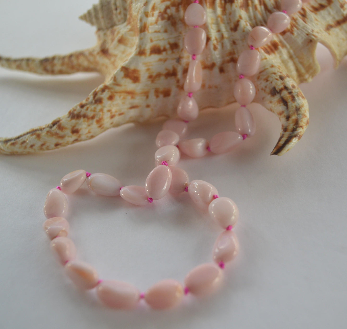 Pink Opal Smooth Nuggets Hand Knotted on Custom Fuchsia Silk and Finished with a Sterling Silver Lobster Clasp